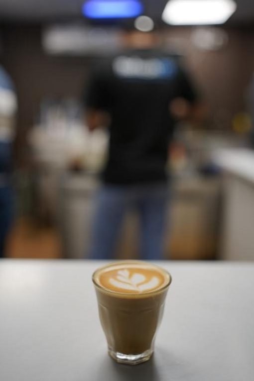 Latte art poured at the bar
